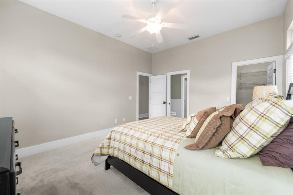1751 Southwest 188th Street Newberry, FL 32669 - Photo 38 of 93 a bedroom with a bed and a chandelier
