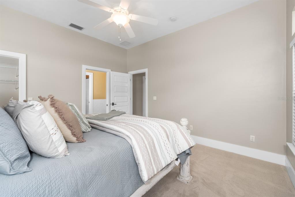 1751 Southwest 188th Street Newberry, FL 32669 - Photo 45 of 93 a bedroom with a bed and a chandelier