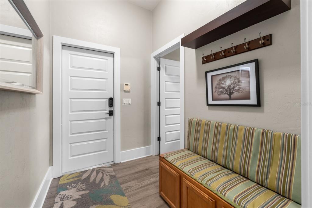 1751 Southwest 188th Street Newberry, FL 32669 - Photo 50 of 93 a view of a hallway with wooden floor and stairs