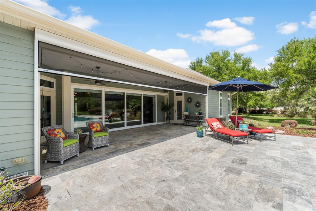 1751 Southwest 188th Street Newberry, FL 32669 - Photo 56 of 93 a view of a chair and tables in patio of the house