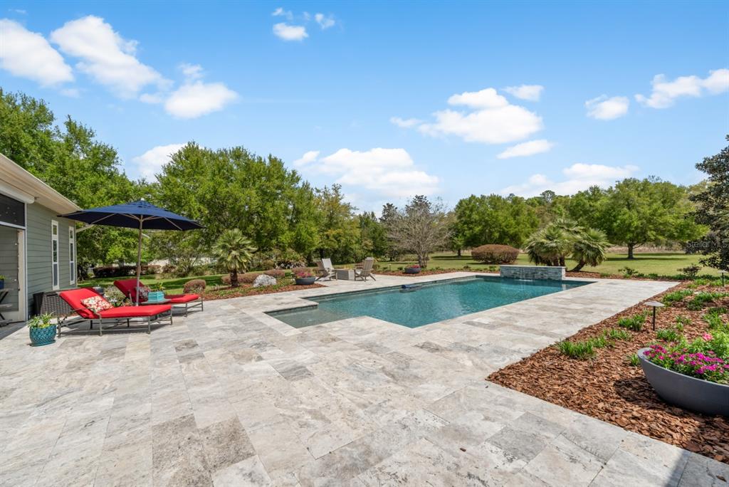 1751 Southwest 188th Street Newberry, FL 32669 - Photo 57 of 93 a view of swimming pool with lounge chair