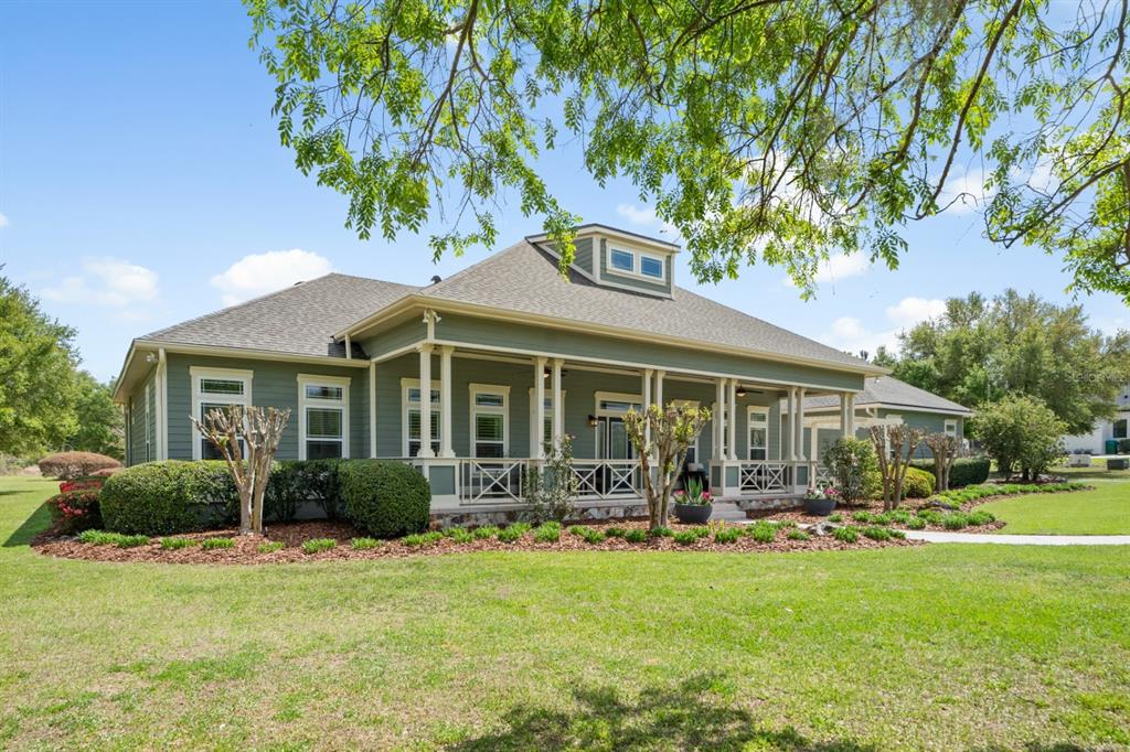 1751 Southwest 188th Street Newberry, FL 32669 - Photo 64 of 93 a front view of a house with garden