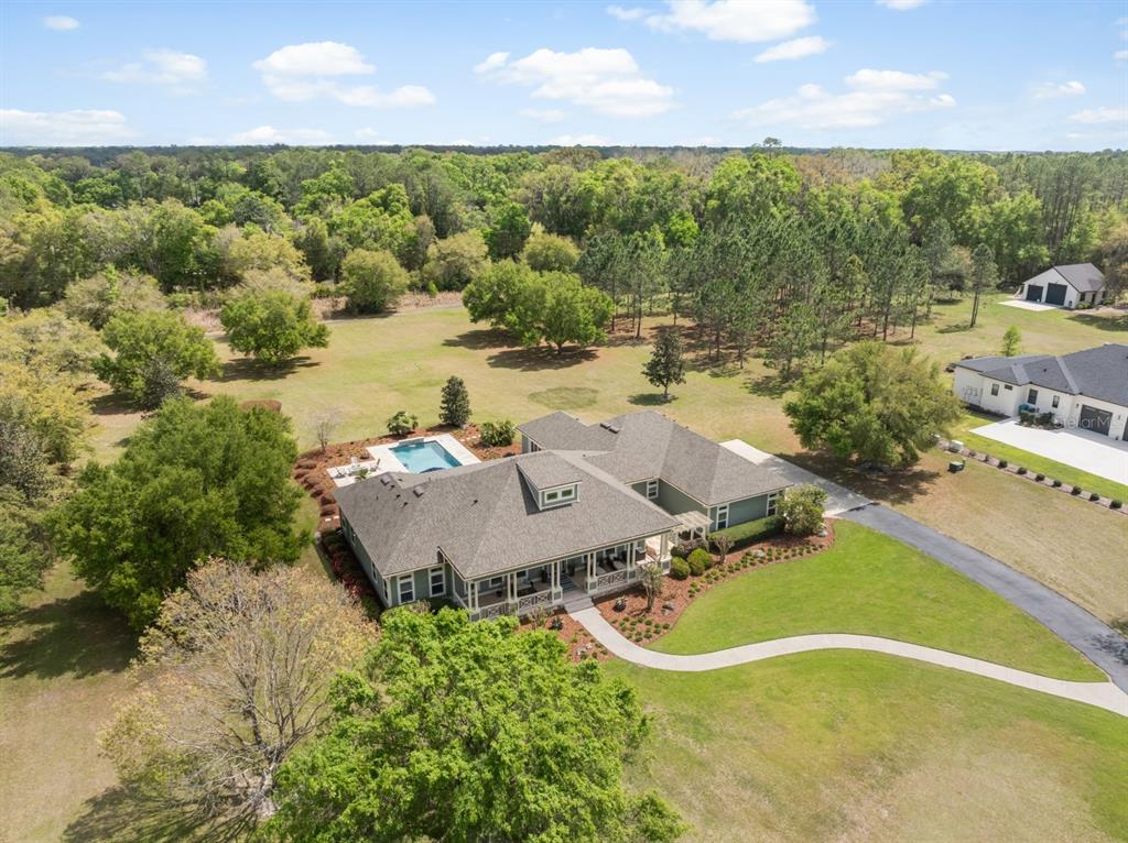 1751 Southwest 188th Street Newberry, FL 32669 - Photo 76 of 93 an aerial view of a house with a yard and lake view