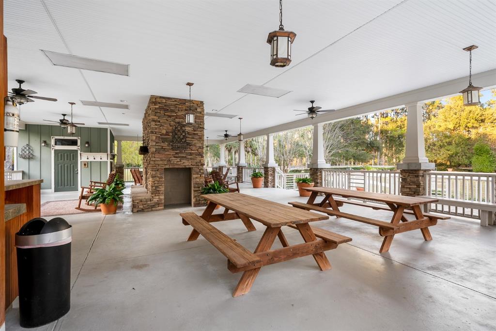 1751 Southwest 188th Street Newberry, FL 32669 - Photo 85 of 93 a living room with patio furniture and a floor to ceiling window