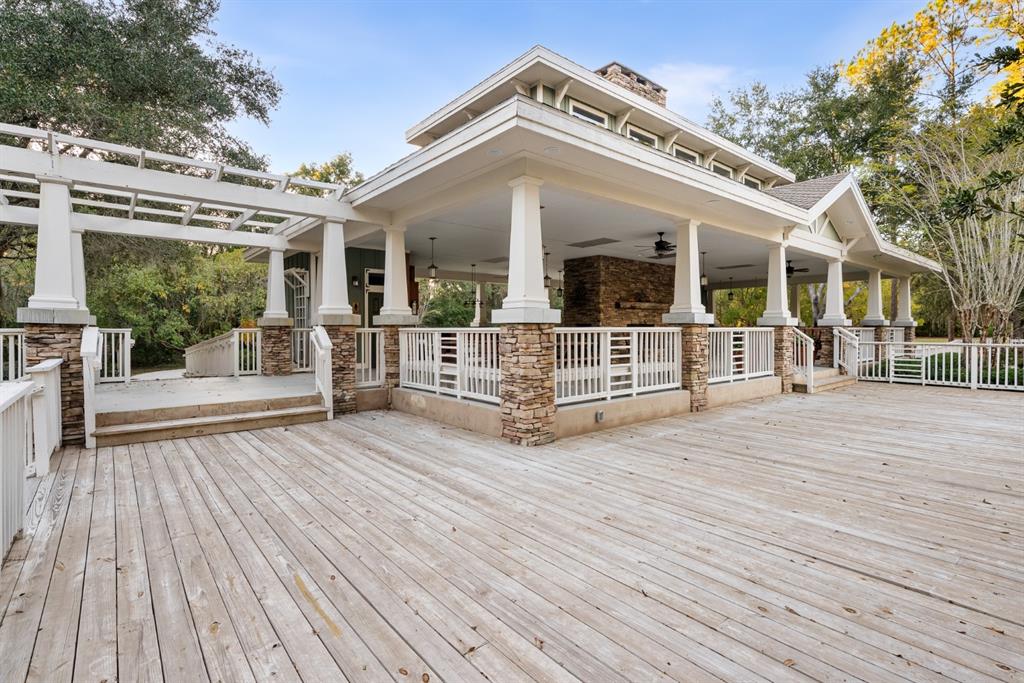 1751 Southwest 188th Street Newberry, FL 32669 - Photo 88 of 93 a view of a house with wooden deck and floor to ceiling windows