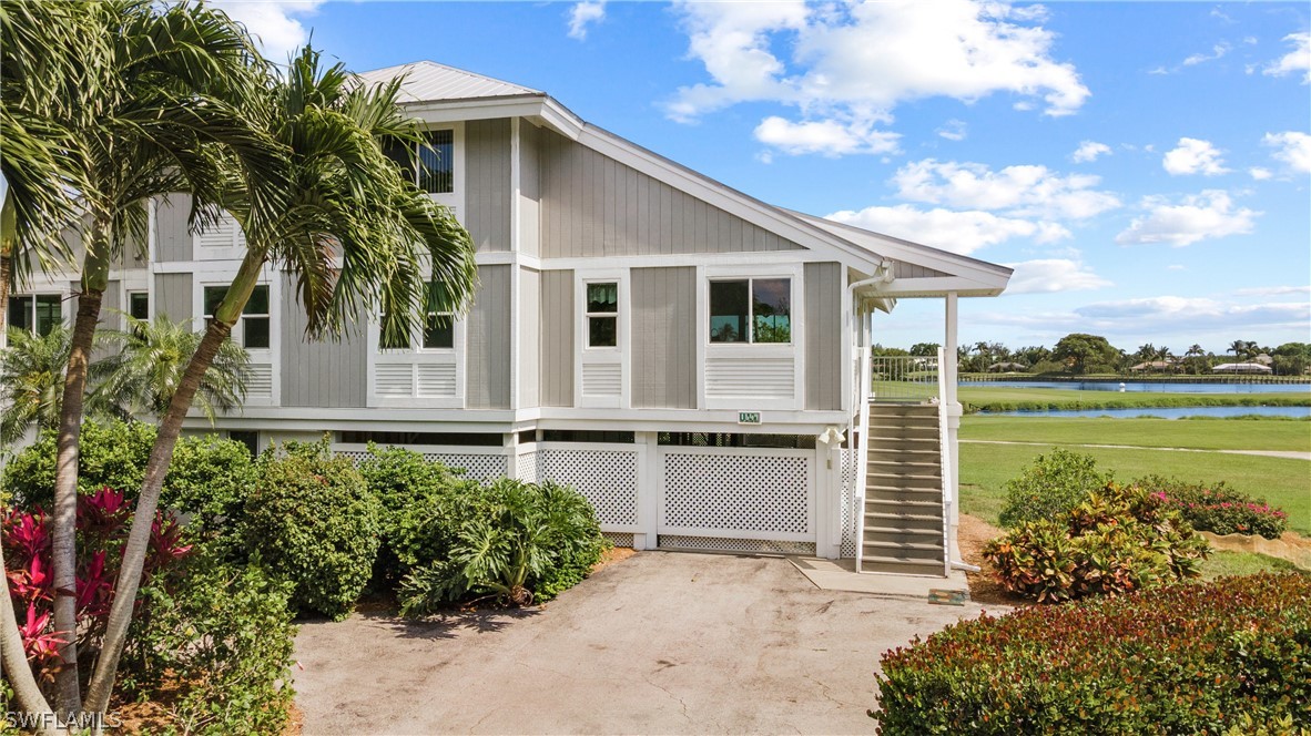 1649 Sand Castle Road Sanibel, FL 33957 - Photo 1 of 34 a front view of a house with a garden