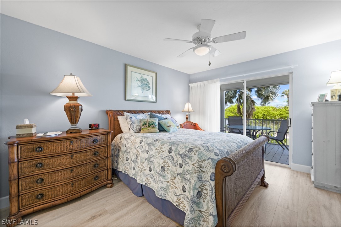 1649 Sand Castle Road Sanibel, FL 33957 - Photo 12 of 34 a bed room with a bed and a window
