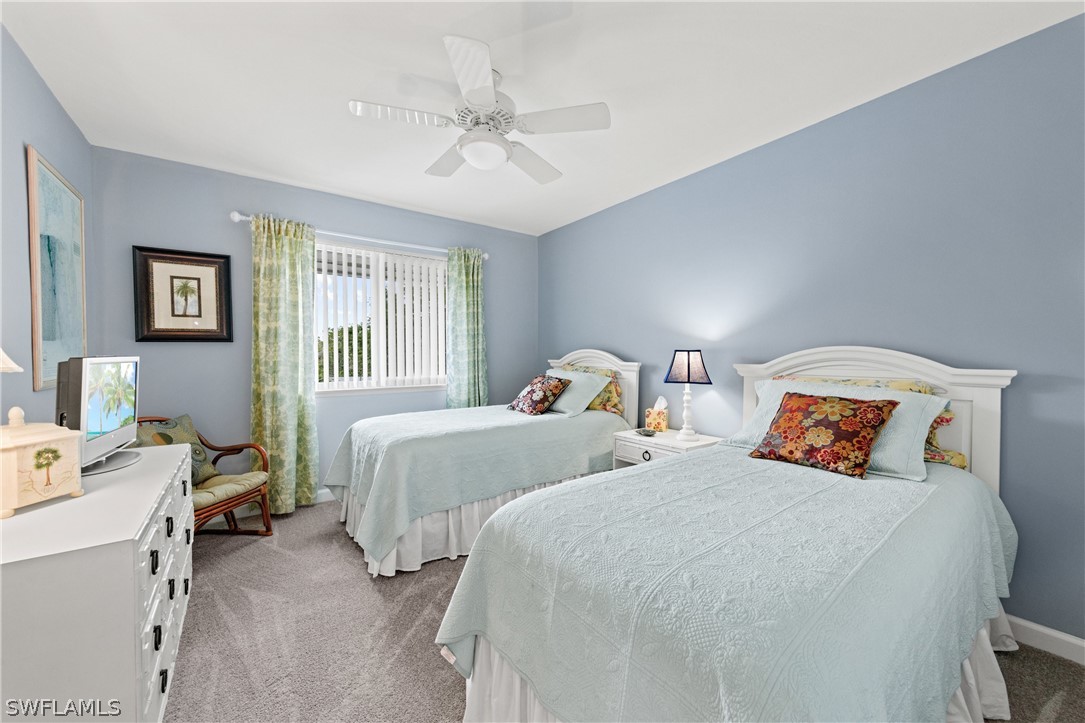 1649 Sand Castle Road Sanibel, FL 33957 - Photo 16 of 34 a bedroom with two beds and a window