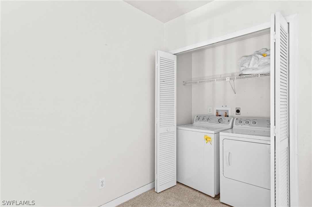1649 Sand Castle Road Sanibel, FL 33957 - Photo 22 of 34 a room with a sink a window and cabinets