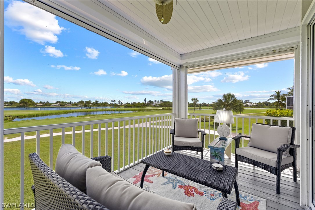 1649 Sand Castle Road Sanibel, FL 33957 - Photo 24 of 34 a balcony with furniture and view of lake