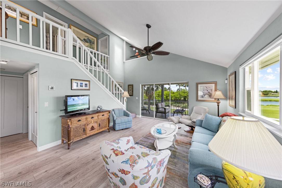 1649 Sand Castle Road Sanibel, FL 33957 - Photo 3 of 34 a living room with furniture fireplace and a large window
