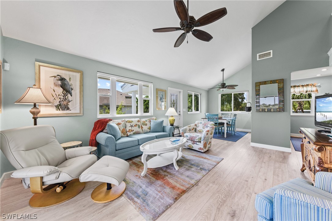 1649 Sand Castle Road Sanibel, FL 33957 - Photo 5 of 34 a living room with furniture and wooden floor