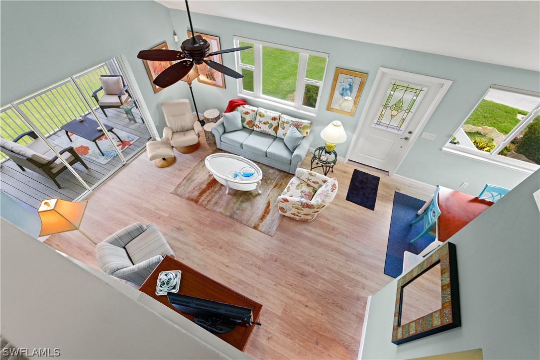 1649 Sand Castle Road Sanibel, FL 33957 - Photo 6 of 34 a living room with furniture and wooden floor