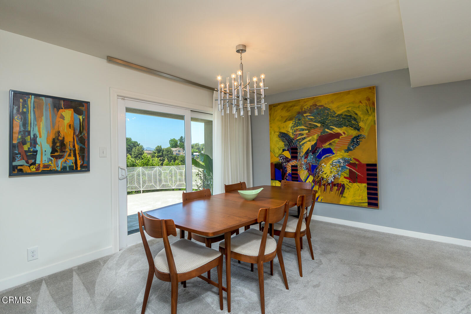 667 Glen Avenue Glendale, CA 91206 - Photo 11 of 46 a view of a dining room with furniture a chandelier and a painting
