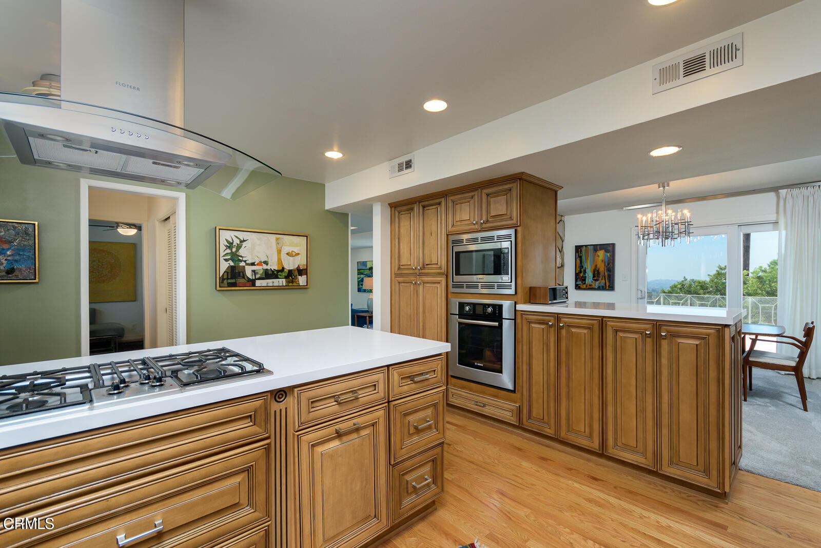 667 Glen Avenue Glendale, CA 91206 - Photo 15 of 46 a kitchen with stainless steel appliances kitchen island granite countertop a refrigerator and stove