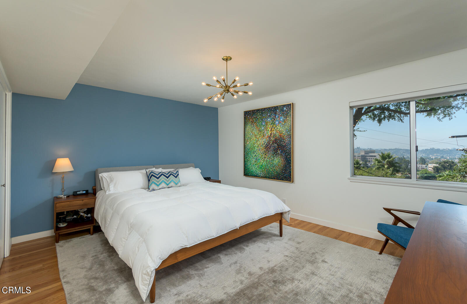 667 Glen Avenue Glendale, CA 91206 - Photo 20 of 46 a bedroom with a bed and a chandelier