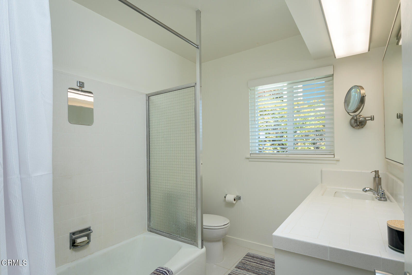 667 Glen Avenue Glendale, CA 91206 - Photo 29 of 46 a bathroom with a sink a toilet and shower