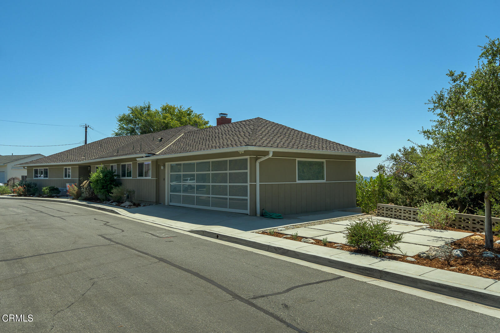 667 Glen Avenue Glendale, CA 91206 - Photo 36 of 46 a front view of a house with a garden