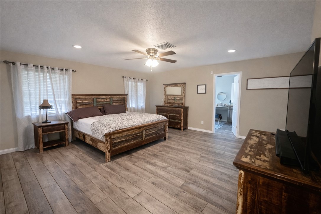 4005 Ridge Trail Robstown, TX 78380 - Photo 15 of 20 a bedroom with a bed and wooden floor