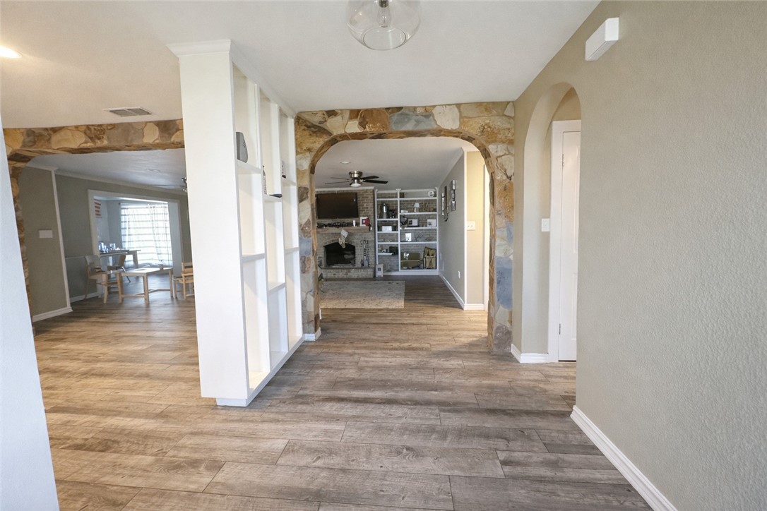 4005 Ridge Trail Robstown, TX 78380 - Photo 6 of 20 a view of a hallway view with wooden floor and living room