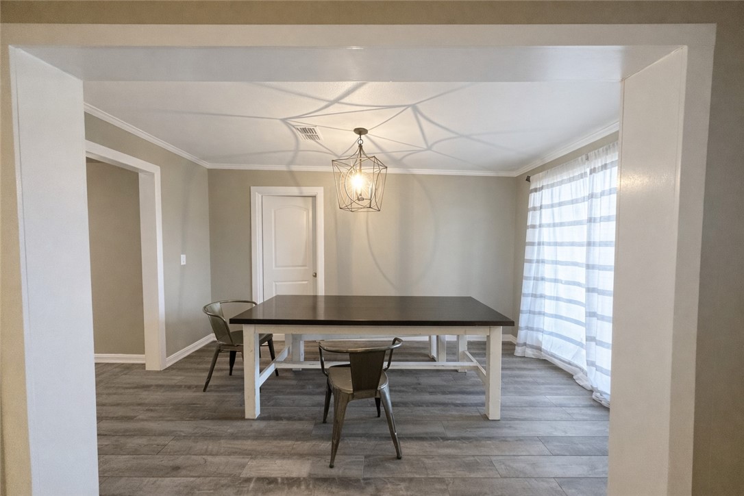 4005 Ridge Trail Robstown, TX 78380 - Photo 9 of 20 a view of a dining room with furniture and wooden floor