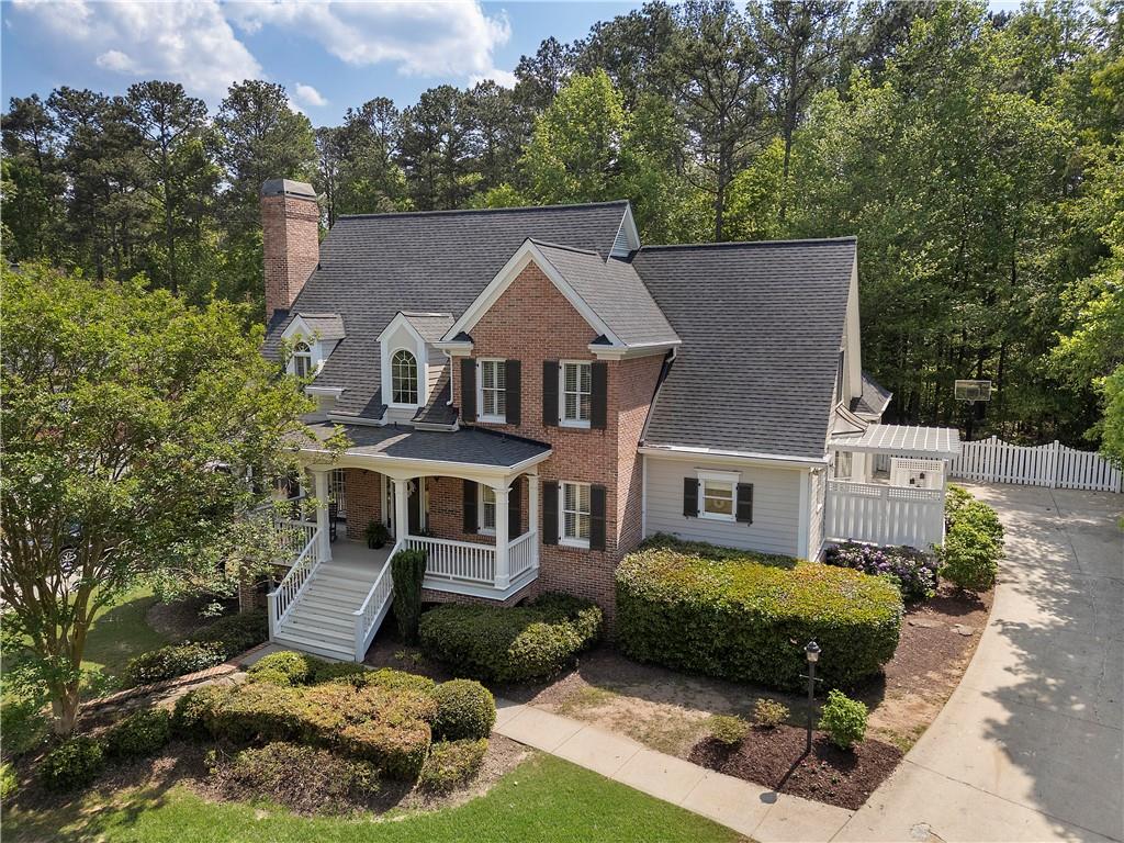 1174 Bowerie Chase Powder Springs, GA 30127 - Photo 1 of 70 a aerial view of a house next to a yard