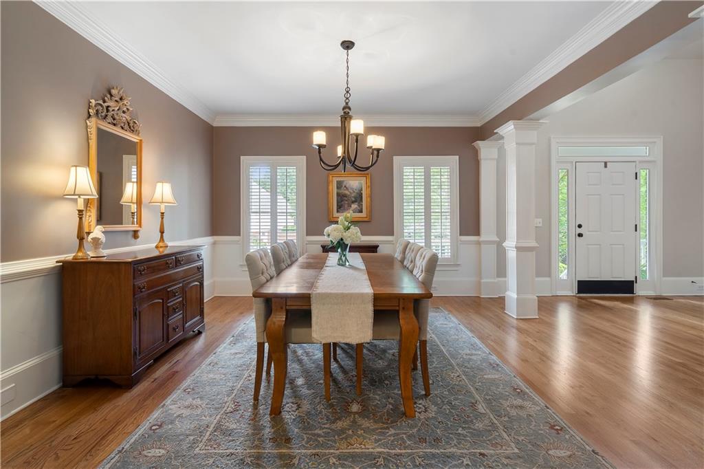 1174 Bowerie Chase Powder Springs, GA 30127 - Photo 11 of 70 a view of a dining room with furniture window and wooden floor