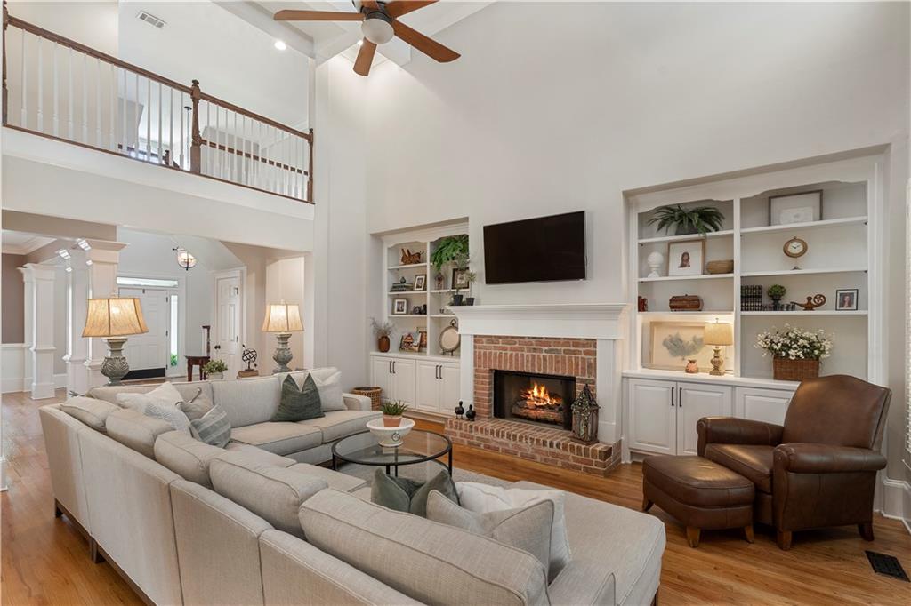 1174 Bowerie Chase Powder Springs, GA 30127 - Photo 18 of 70 a living room with furniture fireplace and a flat screen tv