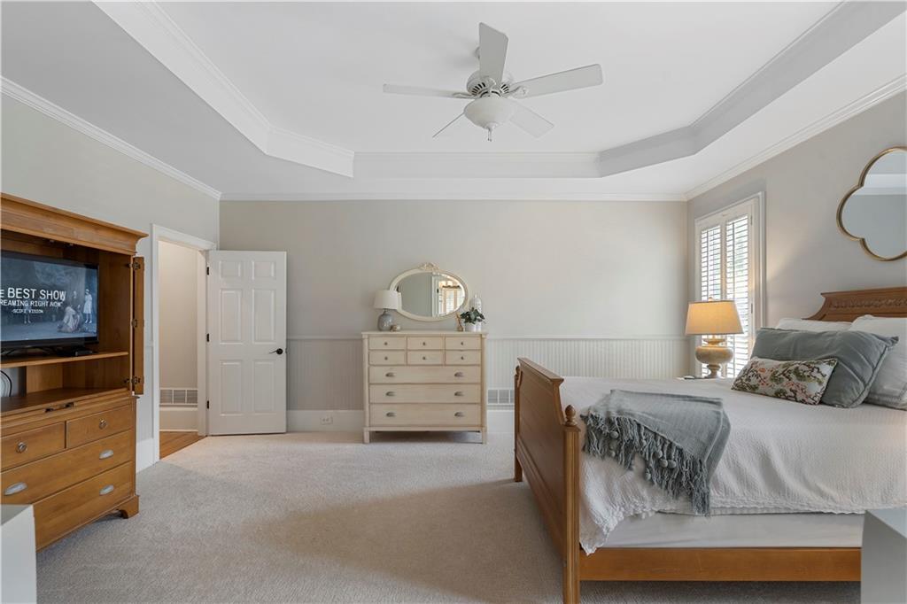 1174 Bowerie Chase Powder Springs, GA 30127 - Photo 25 of 70 a bedroom with furniture and a flat screen tv