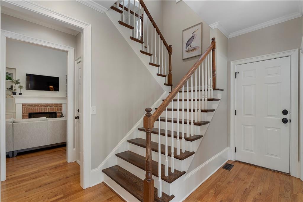 1174 Bowerie Chase Powder Springs, GA 30127 - Photo 29 of 70 a view of entryway with wooden floor and staircase
