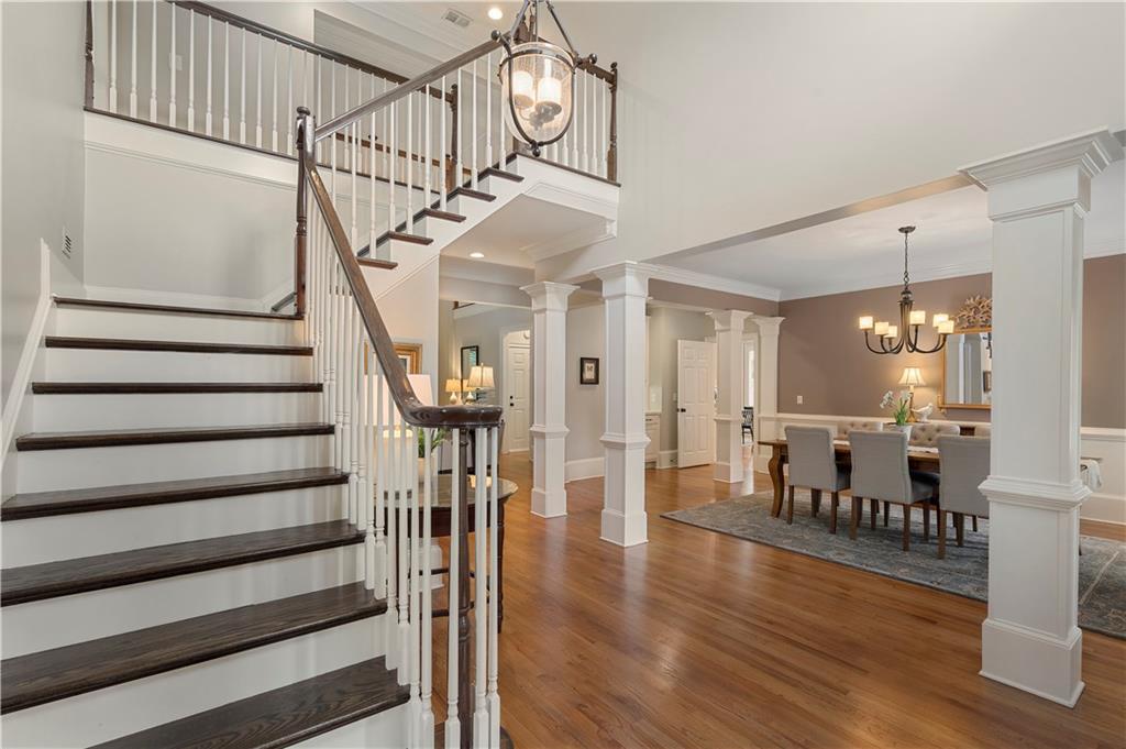 1174 Bowerie Chase Powder Springs, GA 30127 - Photo 3 of 70 a view of entryway dining room and hall with wooden floor