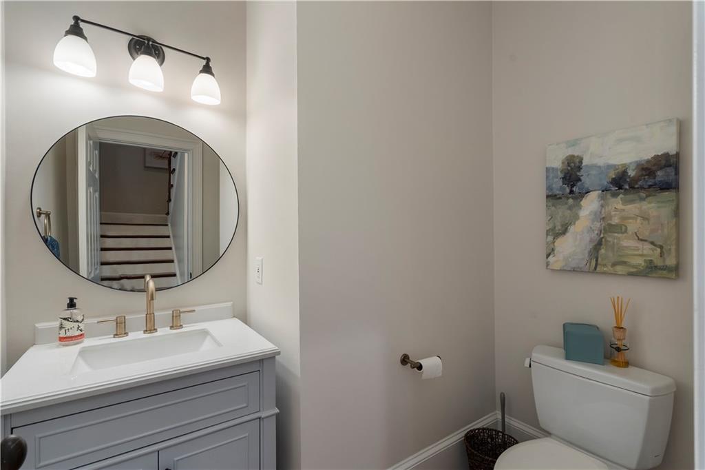 1174 Bowerie Chase Powder Springs, GA 30127 - Photo 32 of 70 a bathroom with a sink and a mirror