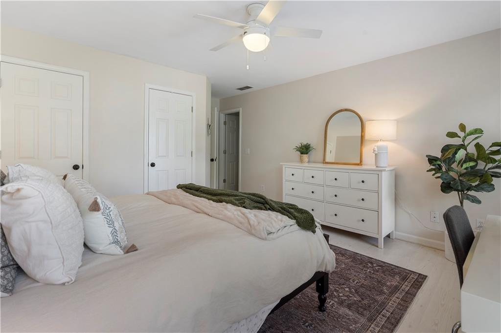 1174 Bowerie Chase Powder Springs, GA 30127 - Photo 38 of 70 a bedroom with a bed and a dresser