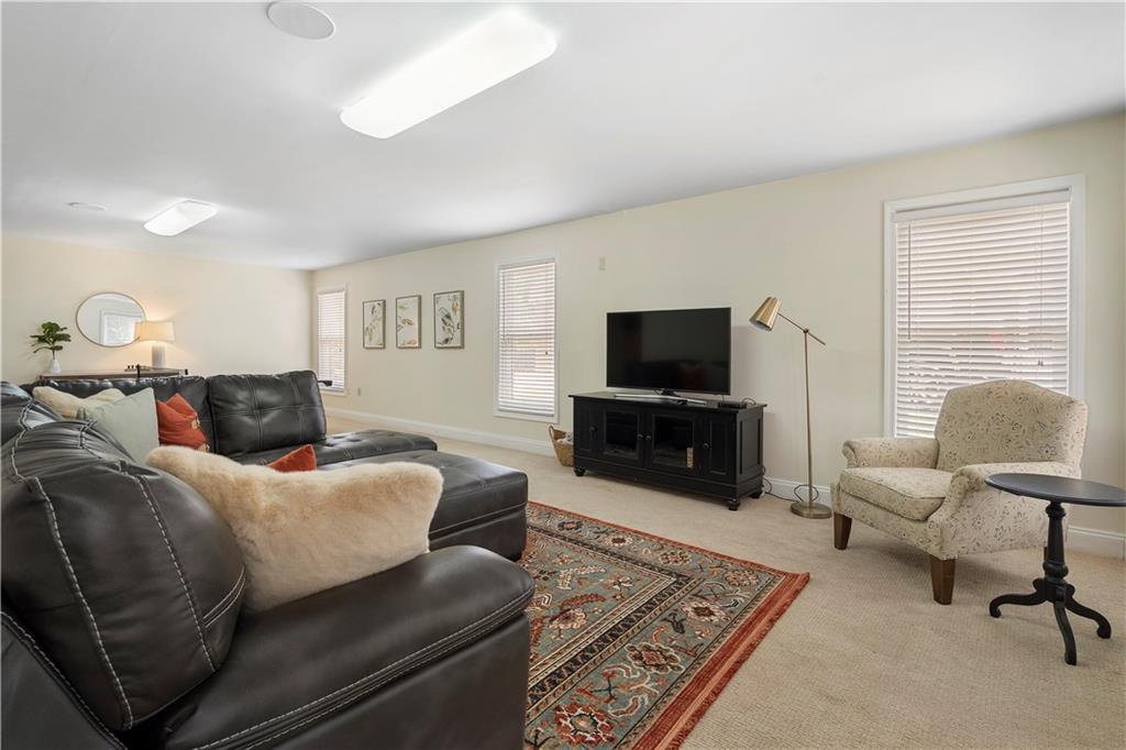 1174 Bowerie Chase Powder Springs, GA 30127 - Photo 53 of 70 a living room with furniture and a flat screen tv