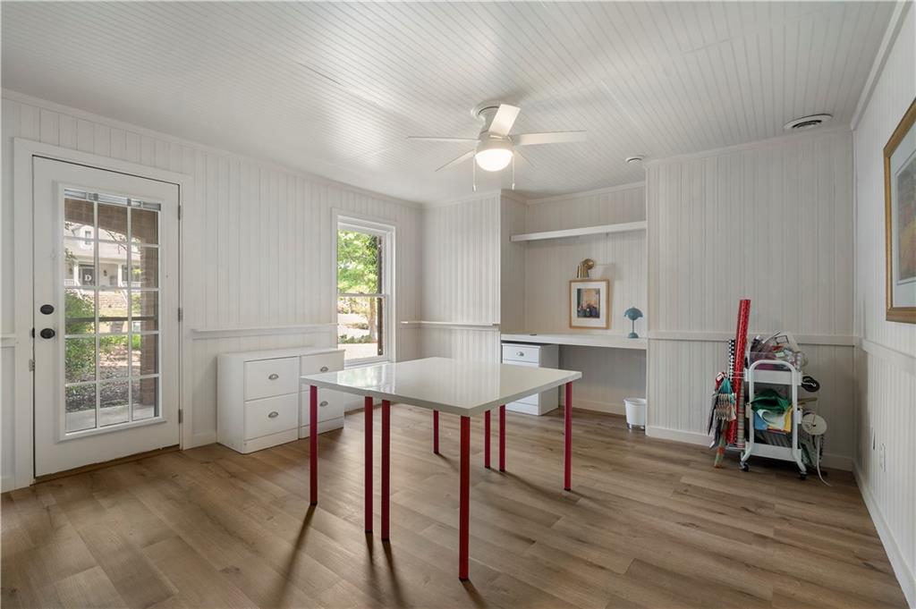 1174 Bowerie Chase Powder Springs, GA 30127 - Photo 56 of 70 a view of a dining room with furniture and wooden floor