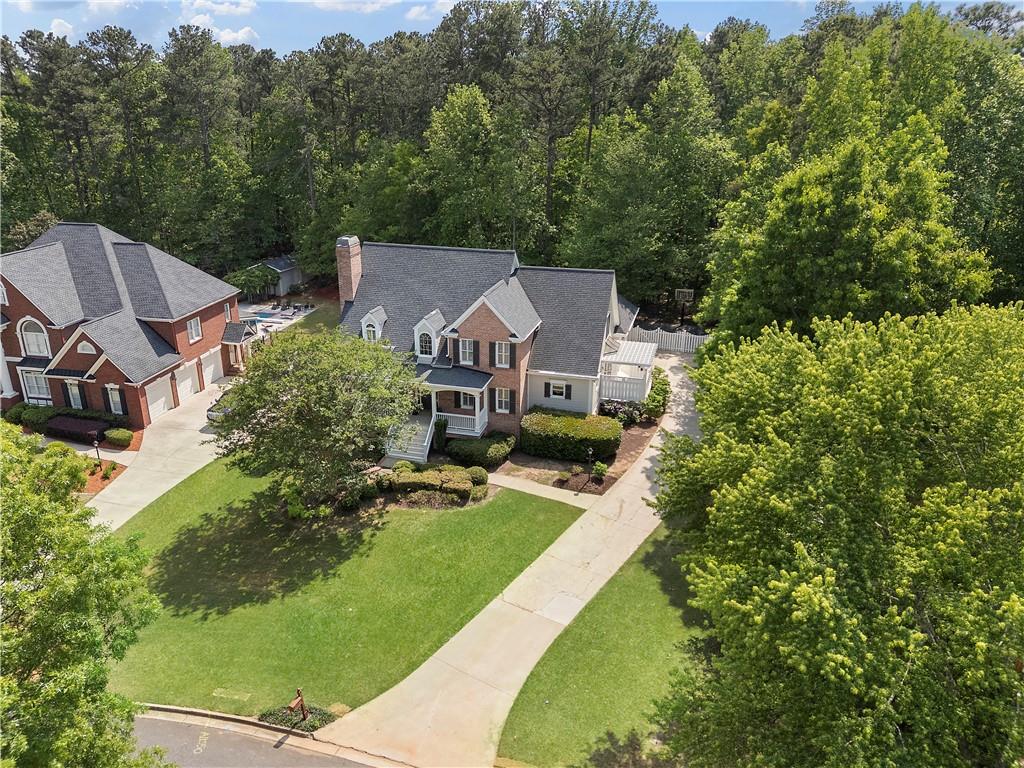 1174 Bowerie Chase Powder Springs, GA 30127 - Photo 61 of 70 an aerial view of residential houses with outdoor space and trees