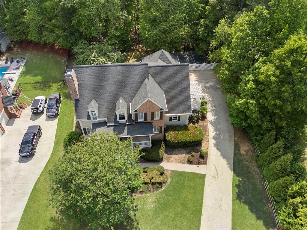 1174 Bowerie Chase Powder Springs, GA 30127 - Photo 63 of 70 an aerial view of a house with swimming pool and garden