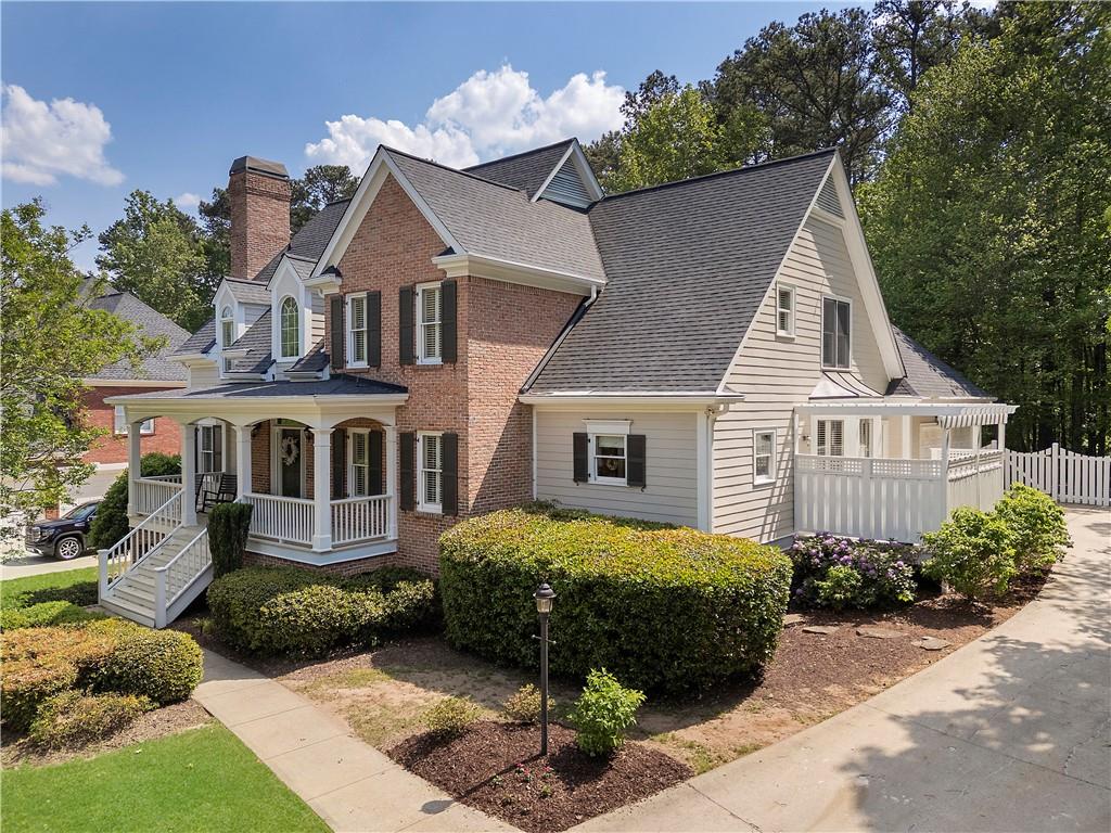 1174 Bowerie Chase Powder Springs, GA 30127 - Photo 65 of 70 a view of a house with a yard and potted plants