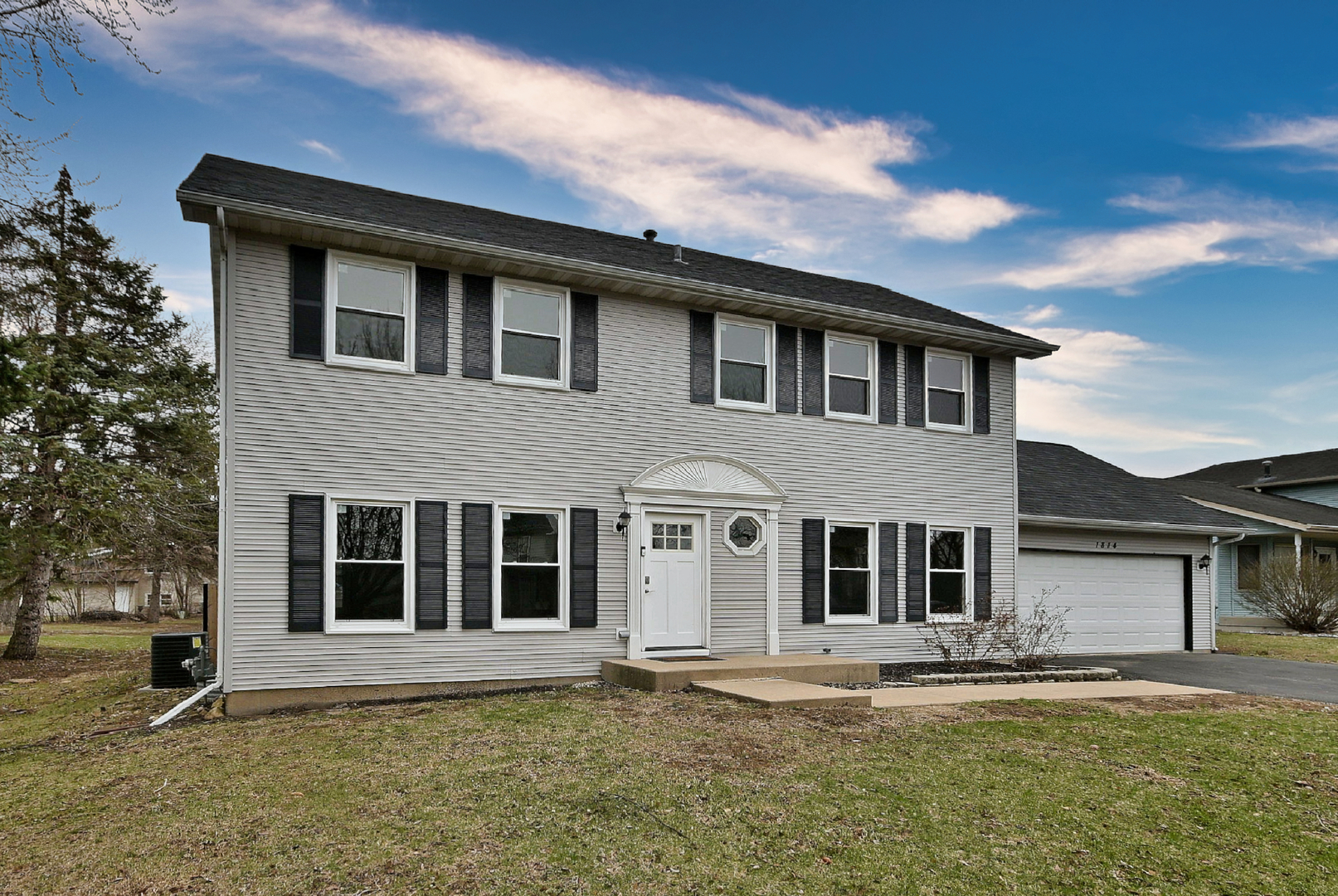1814 Addleman Street Joliet, IL 60431 - Photo 2 of 2 a front view of a house with a yard