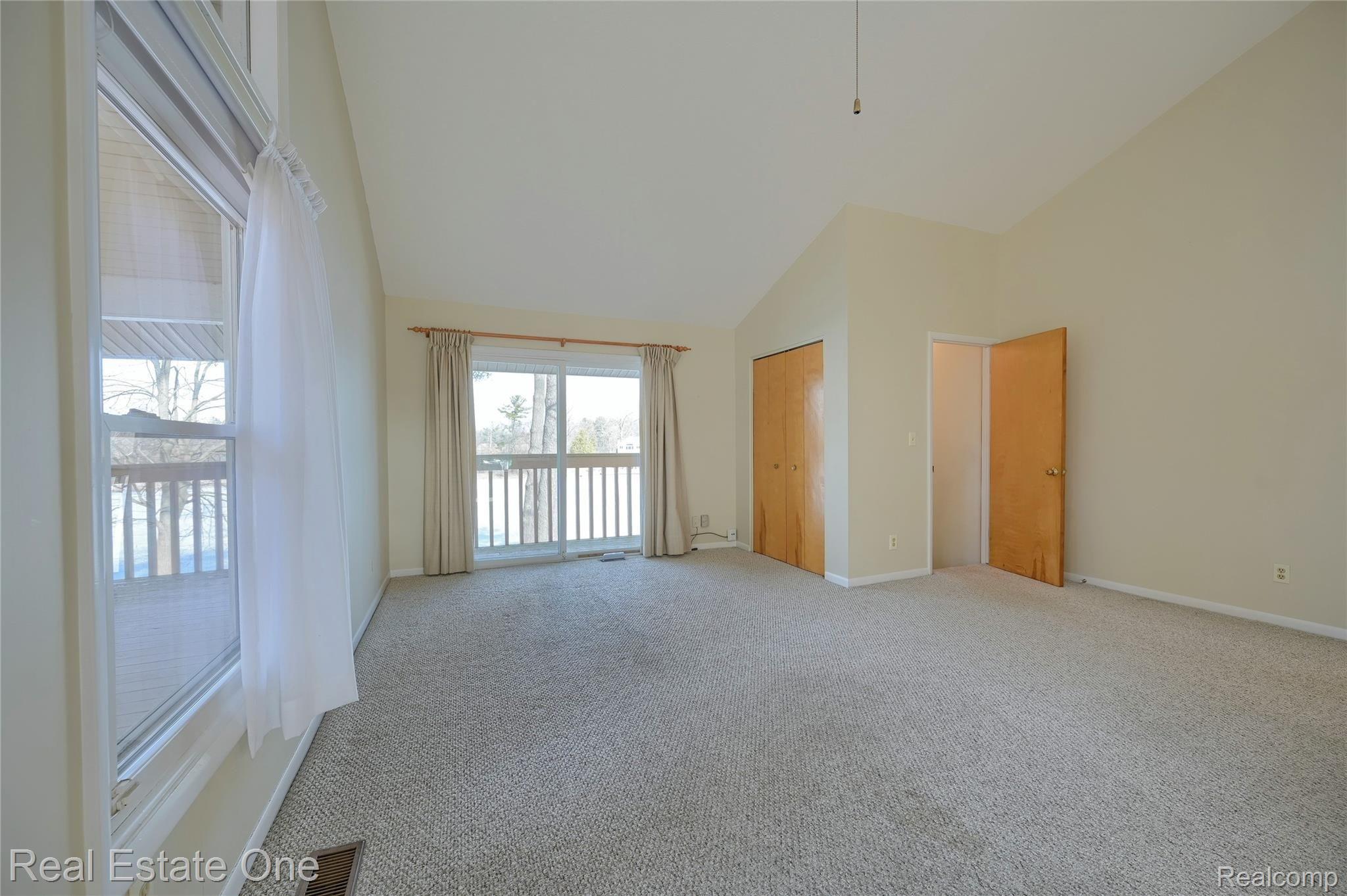 944 Pine Tree Road West Lake Orion, MI 48362 - Photo 31 of 81 Great Room area /doorwall to lakefront decking!