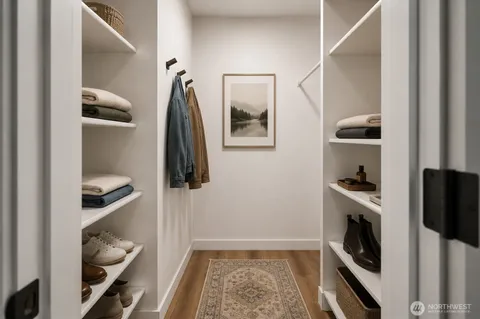 a room with a walk in closet and a window