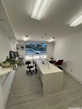 a room with gym equipment and a table