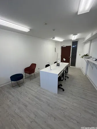 a room with gym equipment and a table