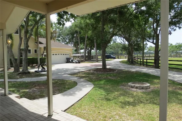 a kitchen with granite countertop wood cabinets and stainless steel appliances