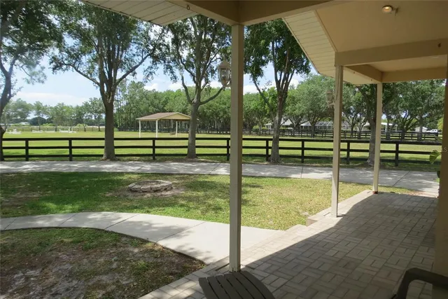 a kitchen with granite countertop cabinets stainless steel appliances and a sink