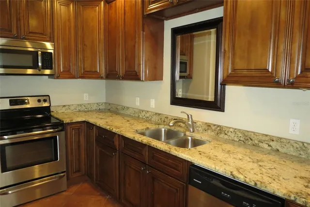 a kitchen with a stove and a microwave