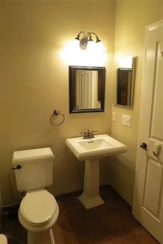 a view of a house with backyard porch and sitting area
