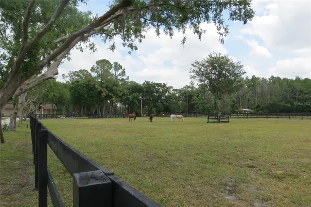 an aerial view of residential house with outdoor space