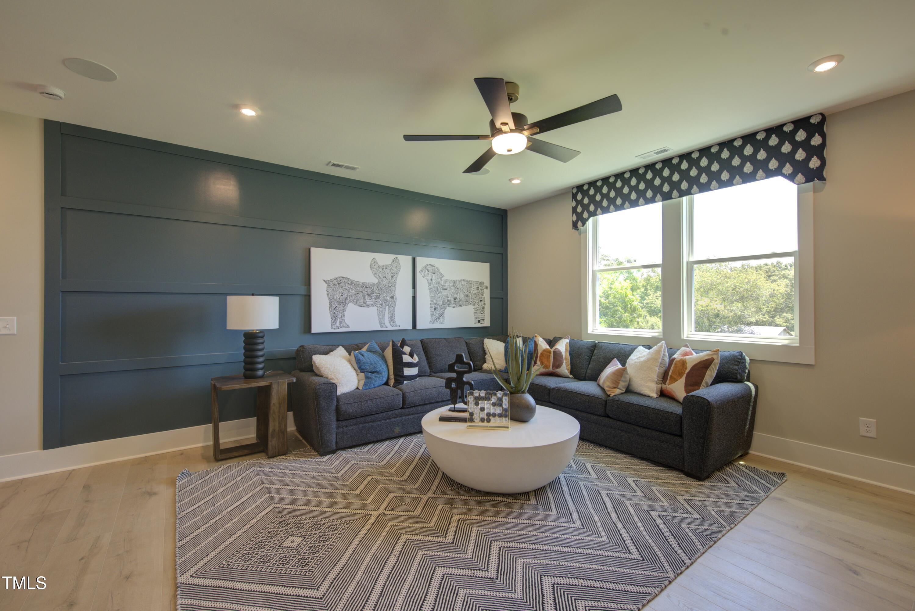 306 Golden Leaf Farms Road Angier, NC 27501 - Photo 12 of 21 a living room with furniture and a large window
