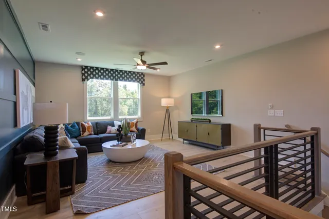 a lobby with furniture and a rug